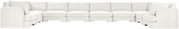 White velvet sectional sofa with modular seats and wide track-style arms