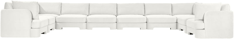 White velvet sectional sofa with modular seats and wide track-style arms