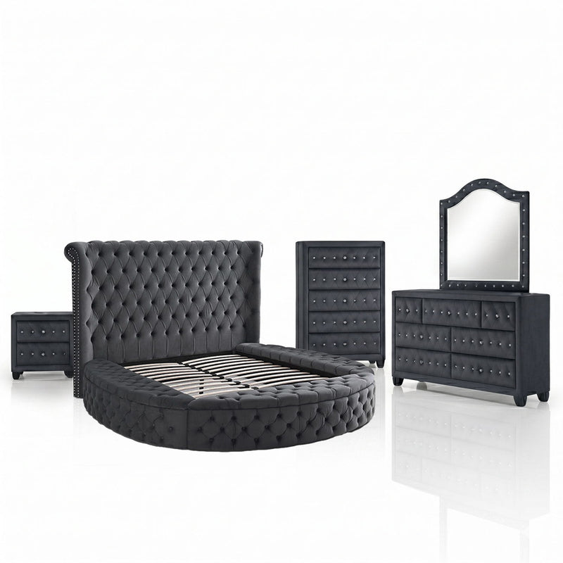 Black tufted storage bed with slat base, nightstand, chest, and mirrored dresser