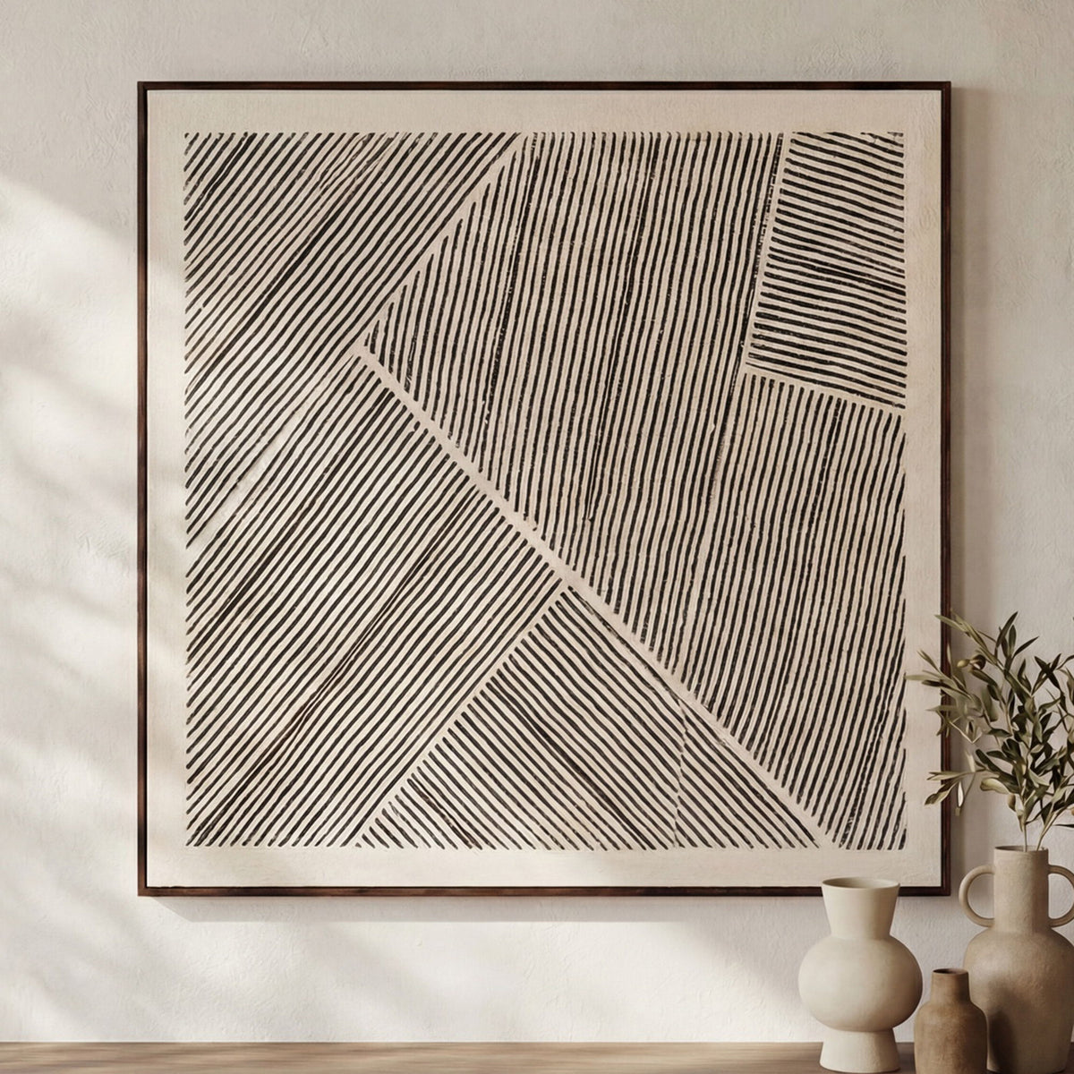 Framed abstract striped painting with diagonal and crosshatch lines in black and gray