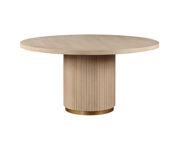 Round light-oak dining table with vertical slat pedestal base.