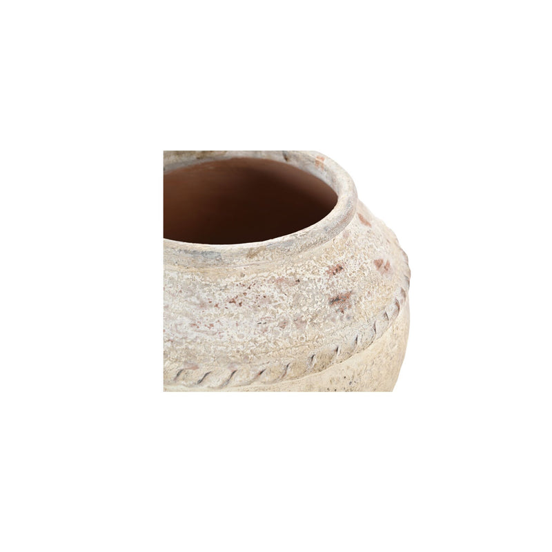 White clay pot close-up with textured rim and open interior