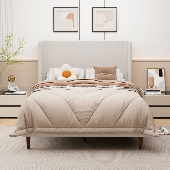 Upholstered bed with tall beige headboard and quilted beige comforter