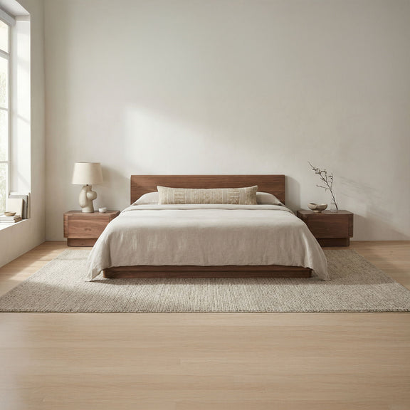 King bed with natural walnut frame and tall headboard, white comforter and pillows