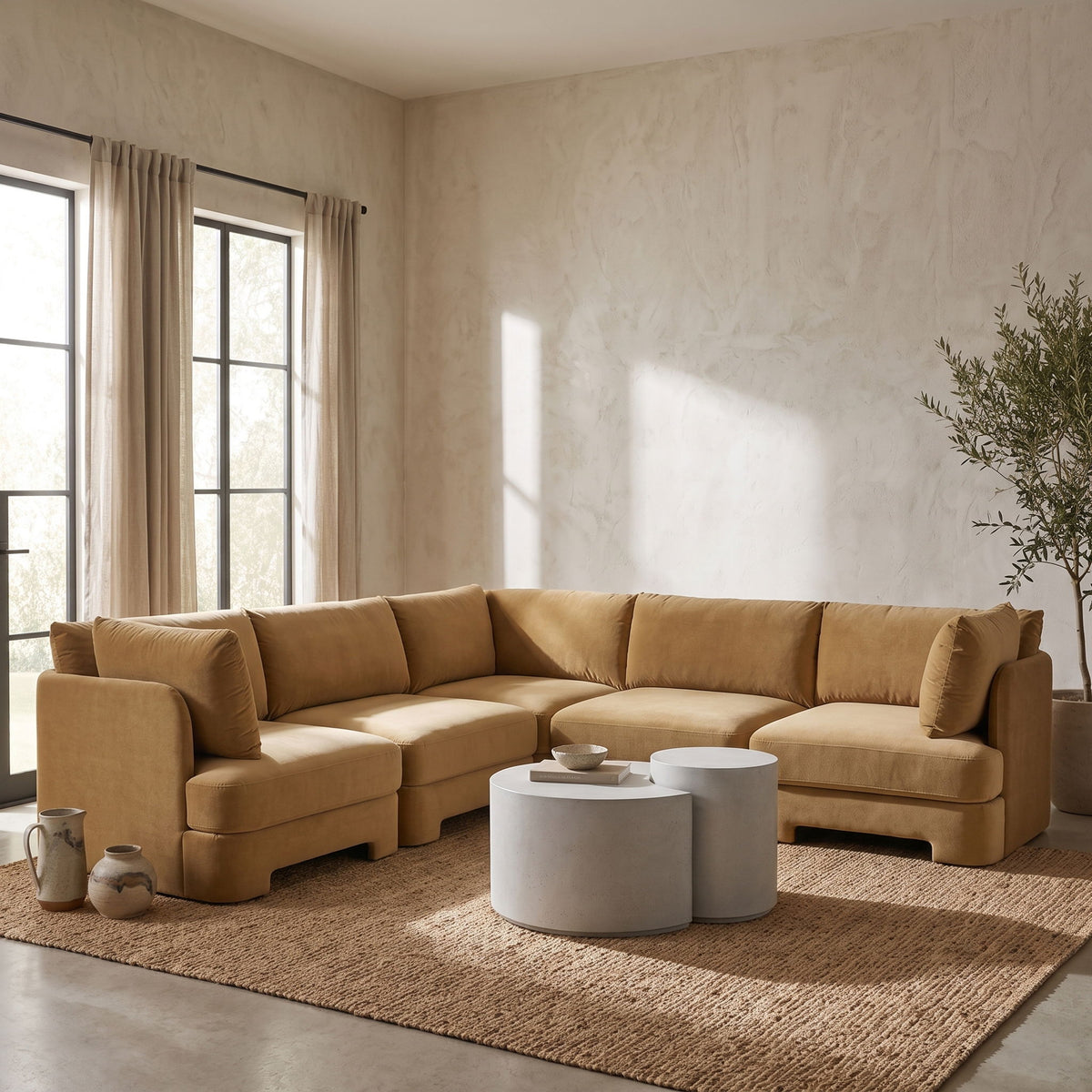 Light brown velvet corner sectional sofa in living room setting with chaise module.