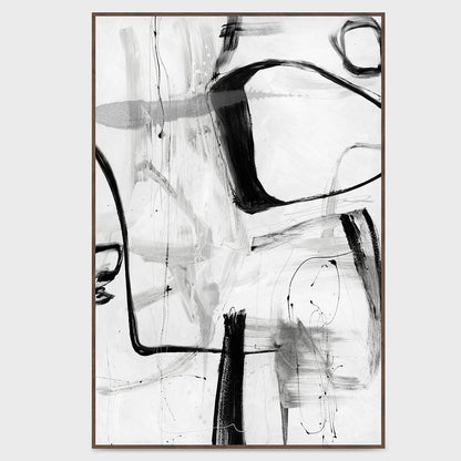 Framed abstract wall art with black brushstrokes on white background