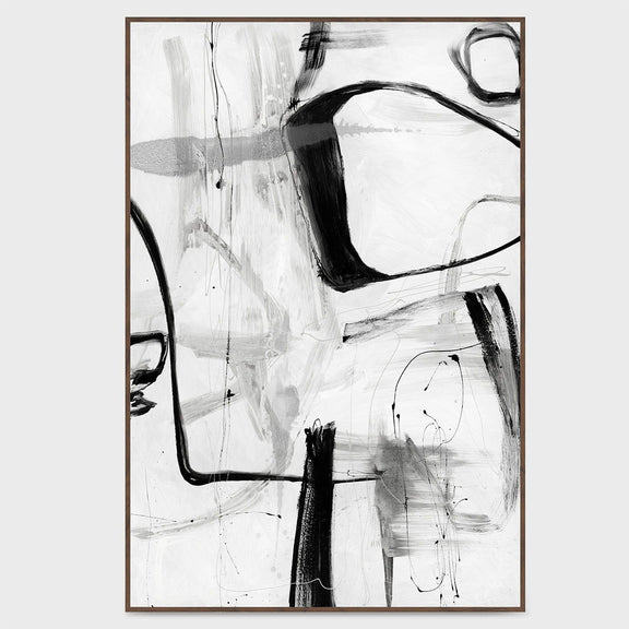 Framed abstract wall art with black brushstrokes on white background