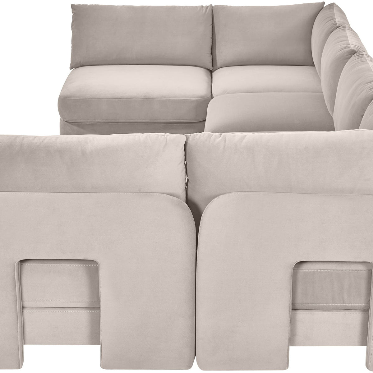 Gray velvet armless sectional sofa close-up with button-free padded panels