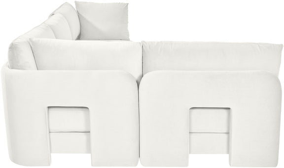 White velvet armless sectional sofa, close-up view of rounded arm panels