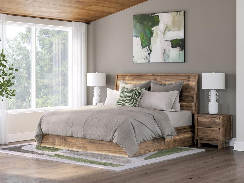 Dark brown panel bed with storage, white comforter and pillows in a styled bedroom