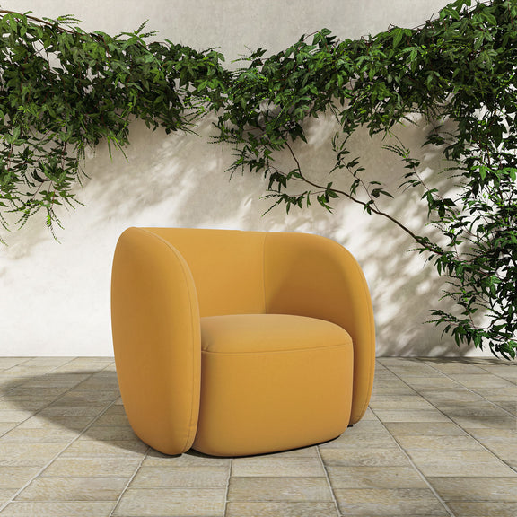 Orange outdoor accent chair with curved back, rounded sides, and upholstered cushion