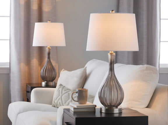 Set of 2 table lamps with white shades and clear glass urn bases, gold-toned hardware.