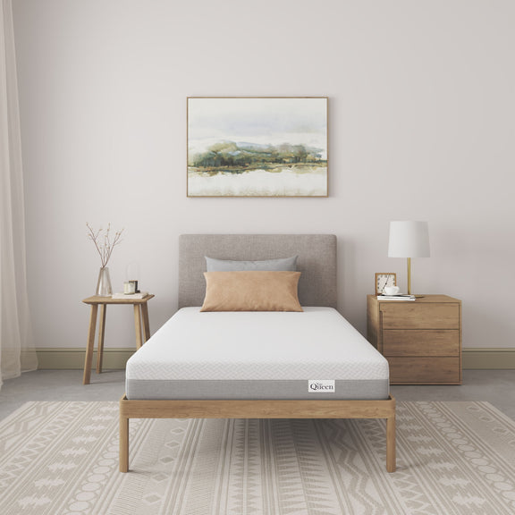 Memory foam mattress with breathable white cover, visible gray side panels