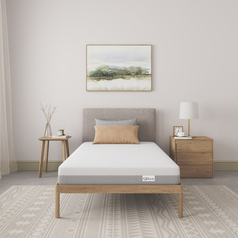 Memory foam mattress with breathable white cover, visible gray side panels