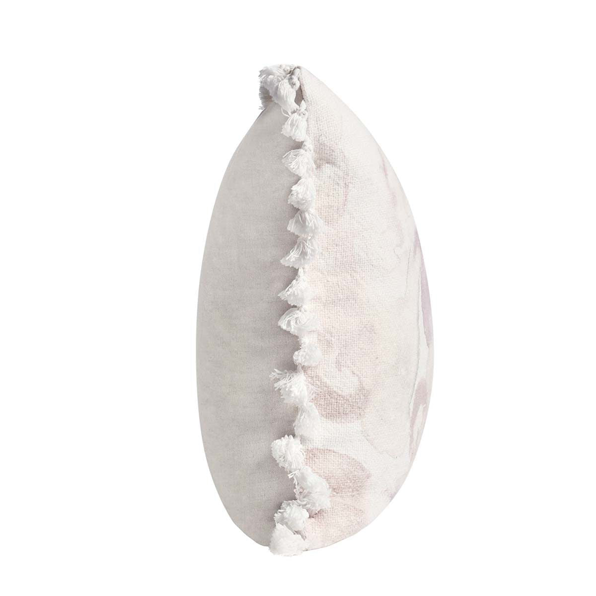 Peach floral pillow close-up showing side tassel fringe edge