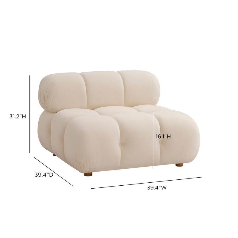Cream armless modular chair, side view, with rounded backrest and plush padded sections