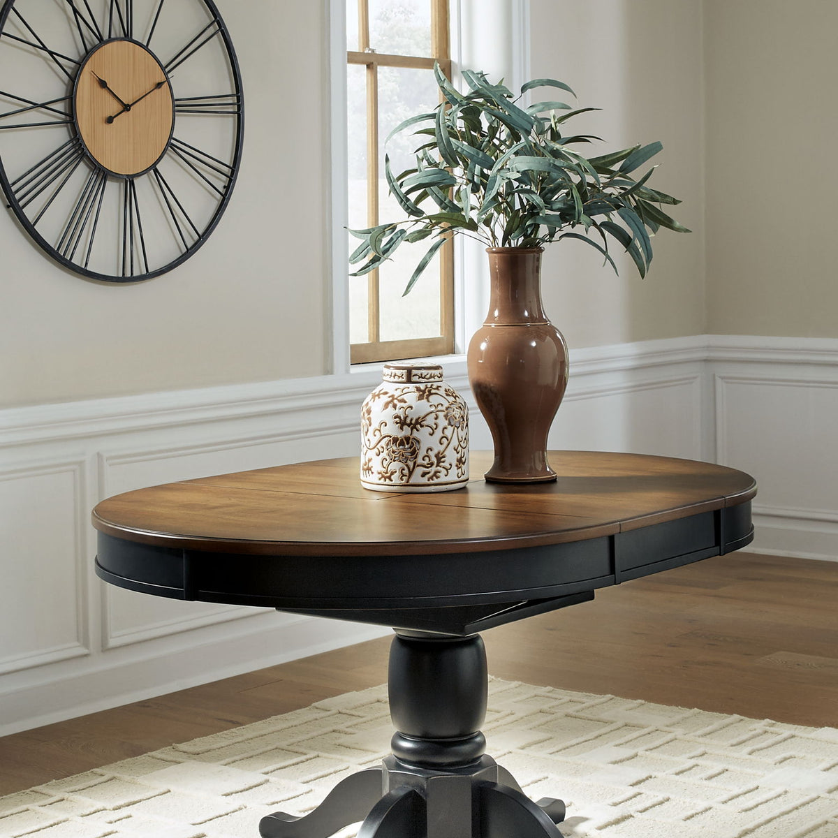 Clorazi - Oval Dining Room Butterfly Extension Table - Black / Brown
