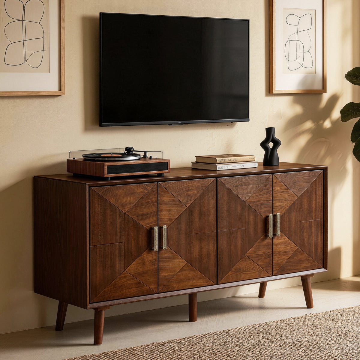 Walnut credenza with four patterned doors, metal handles, and tapered legs