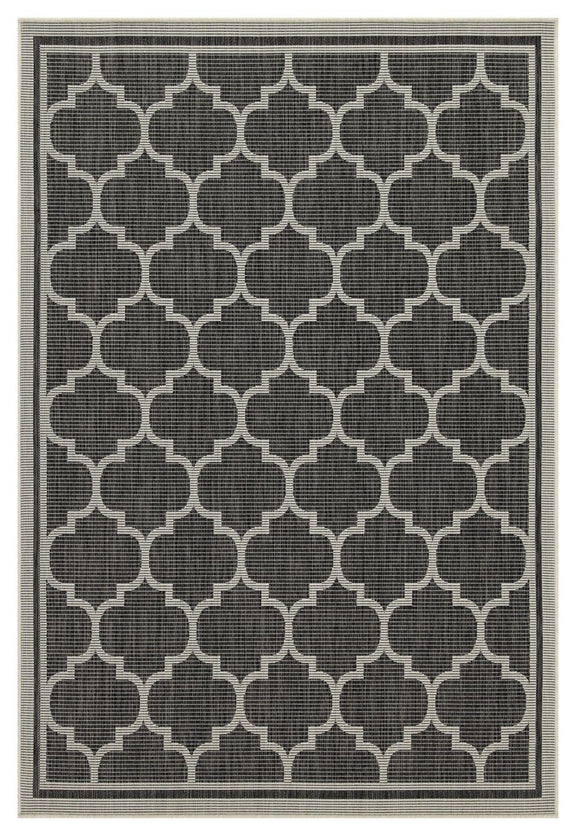 Blue polypropylene area rug with dark gray quatrefoil trellis pattern