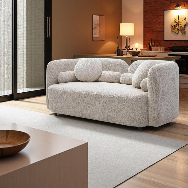 Light beige 2-seat upholstered sofa with large seat cushion and two bolster pillows