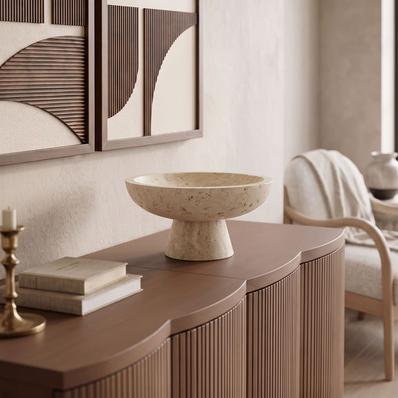 Beige travertine pedestal bowl on sideboard, round basin
