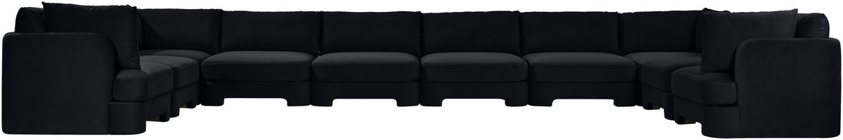 Black velvet sectional sofa with modular ottoman-style seats and cushioned back