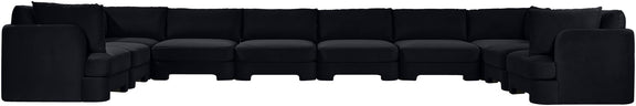 Black velvet sectional sofa with modular ottoman-style seats and cushioned back
