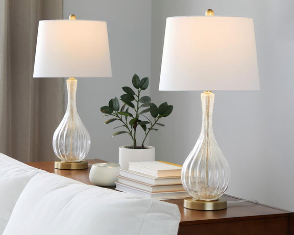 Set of 2 table lamps with white shades and clear glass urn bases, gold accents.