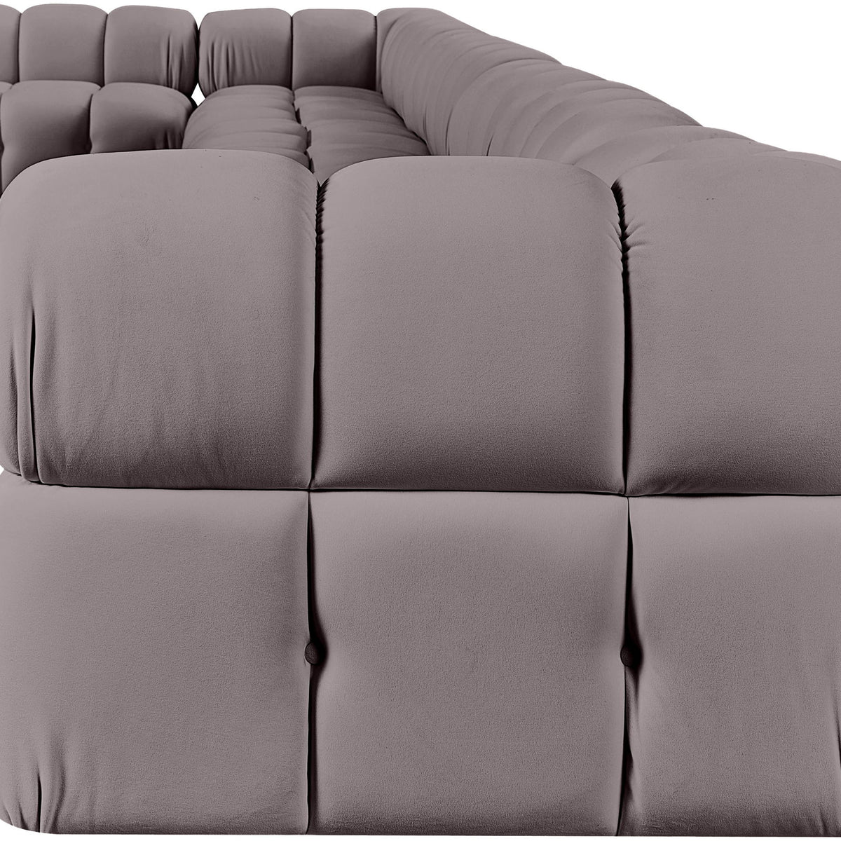 Light gray velvet L-shaped sectional sofa with plush tufted cushion blocks