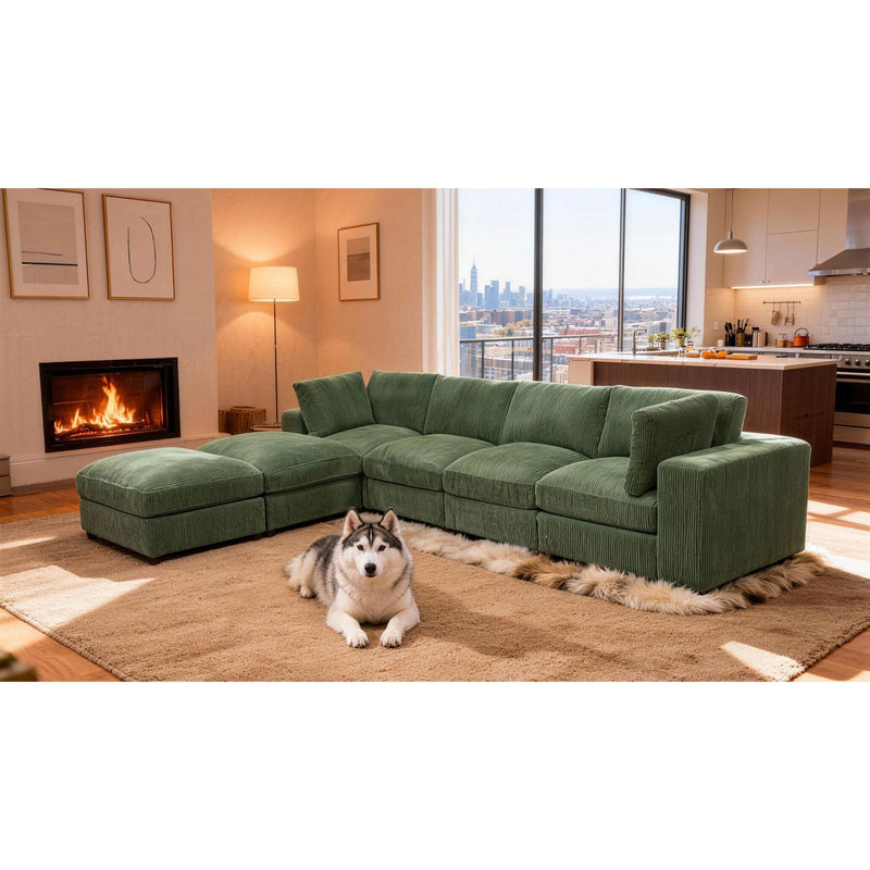 Dark green modular sectional sofa with chaise lounge and ottoman