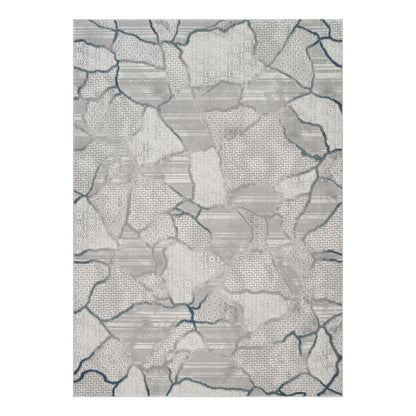 Gray area rug with patchwork map pattern and blue line accents, geometric design
