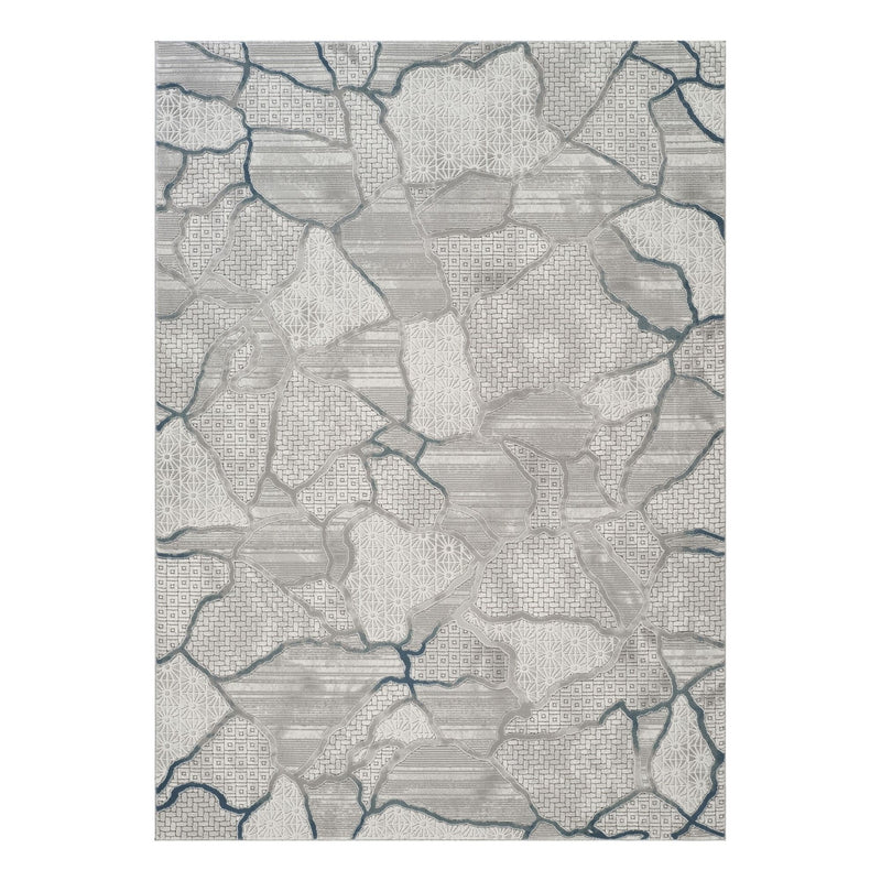 Gray area rug with patchwork map pattern and blue line accents, geometric design