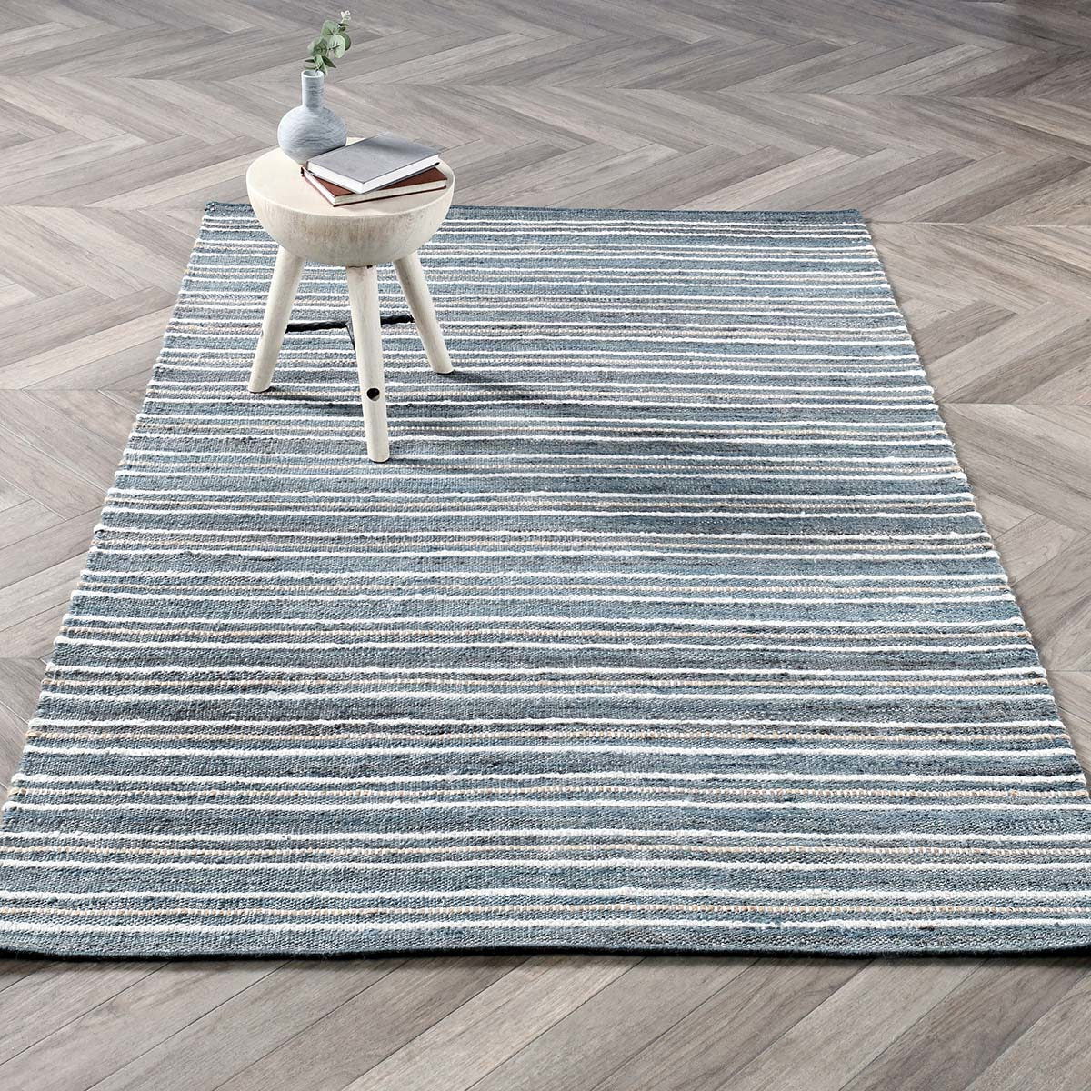 2.6 ft x 8 ft striped rug with blue bands over dark blue ground