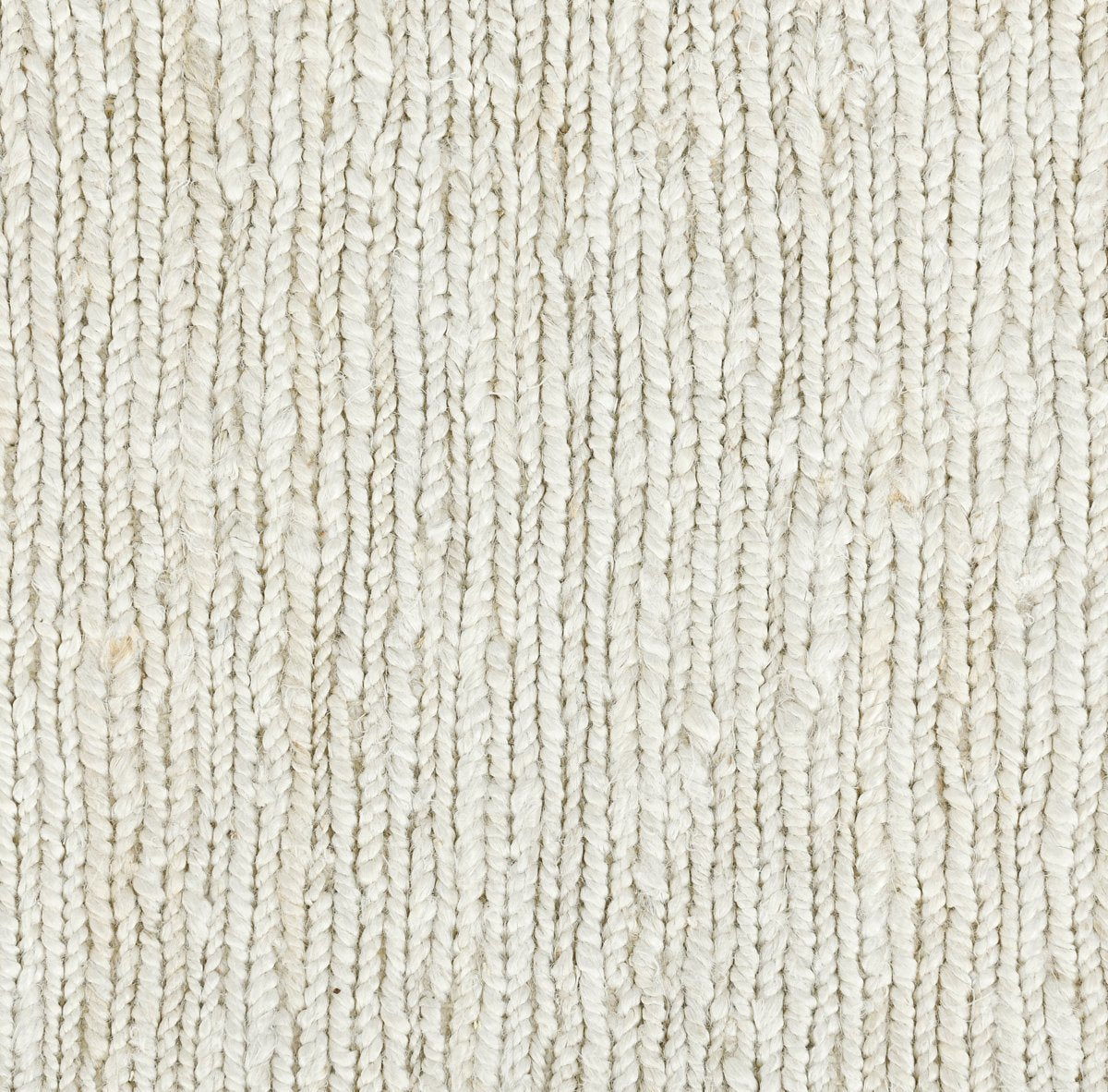 Ivory white jute rug surface close-up, dense flatwoven texture.