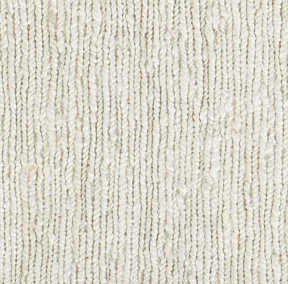Ivory white jute rug surface close-up, dense flatwoven texture.