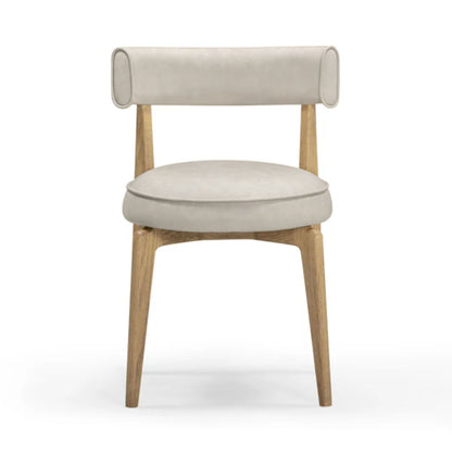 Beige upholstered dining chair with round armrests and light wood legs, angled front view.