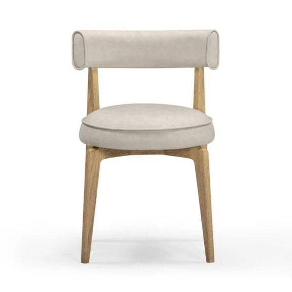 Beige upholstered dining chair with round armrests and light wood legs, angled front view.