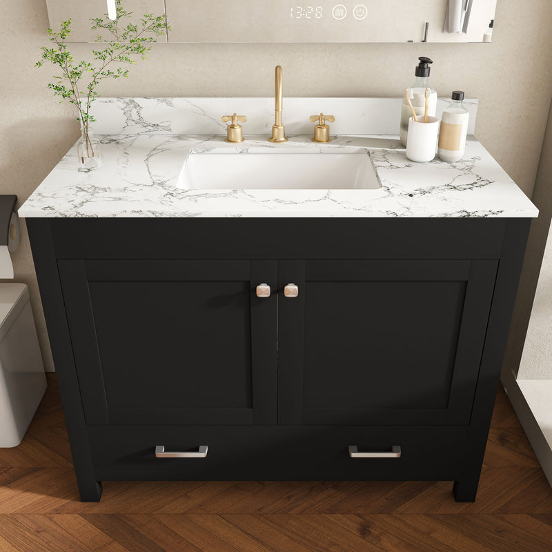 Black bathroom vanity with white countertop, two doors with pulls, and gold faucet