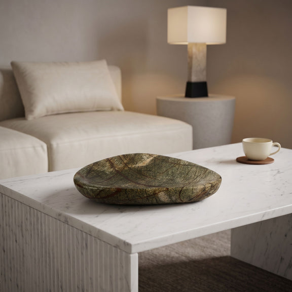 Whelan green marble bowl on a table, shallow oval dish shape