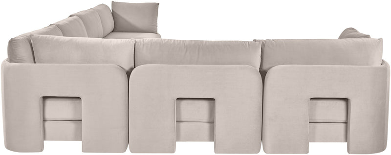 Light gray velvet corner sectional sofa with three front sections and low back pillows