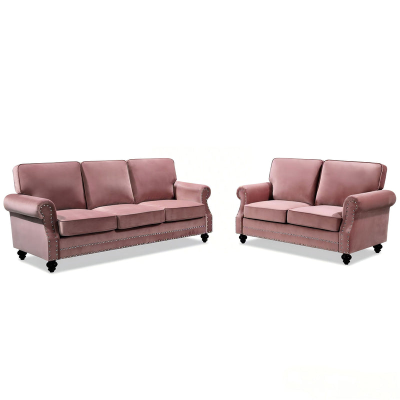 Pink 3-seat sofa with nailhead trim and turned legs, two units shown