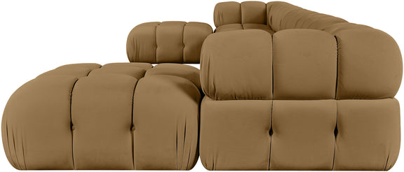 Tan modular sectional sofa with padded tufted seats and rounded ottoman sections