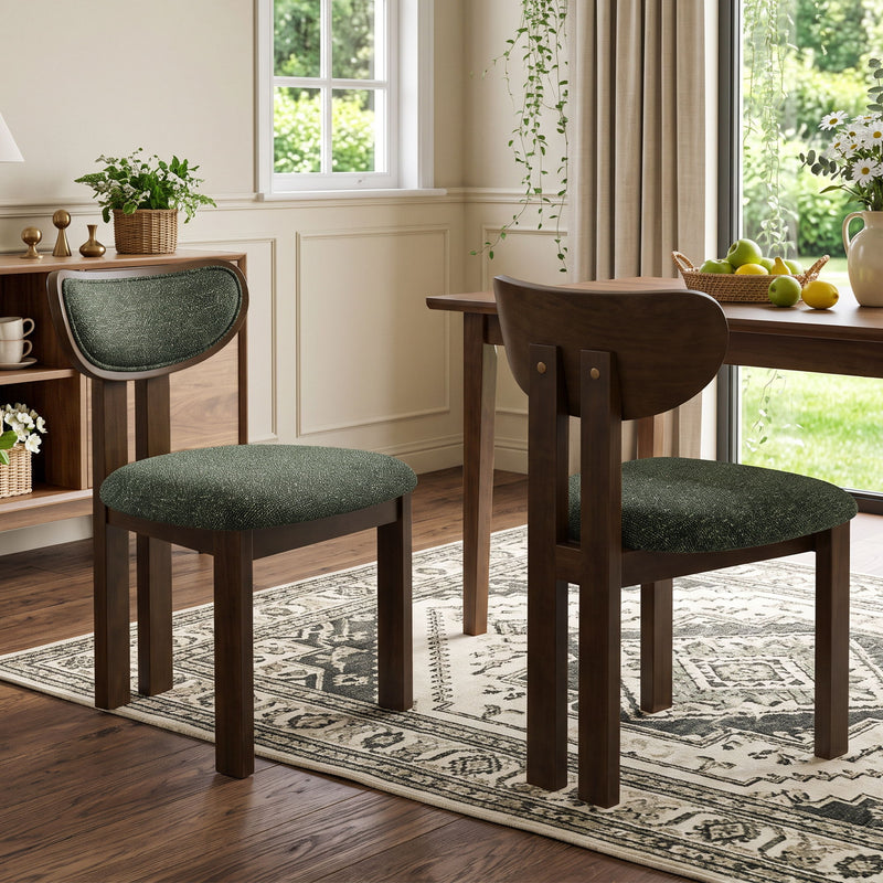 Dark green dining chairs showing upholstered seats and wood back details