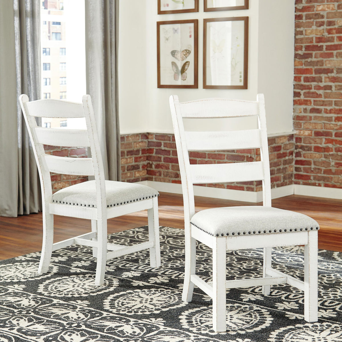 Beige dining side chair with ladder back slats and nailhead-trimmed cushioned seat