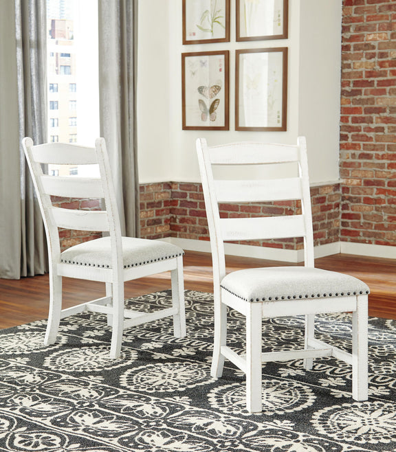 Beige dining side chair with ladder back slats and nailhead-trimmed cushioned seat