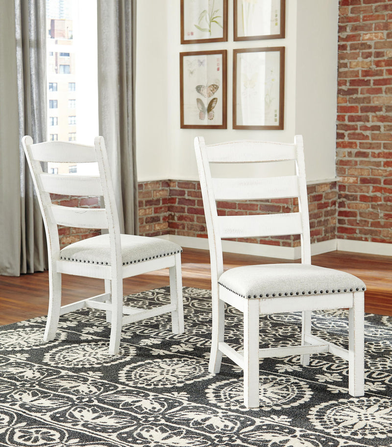 Beige dining side chair with ladder back slats and nailhead-trimmed cushioned seat