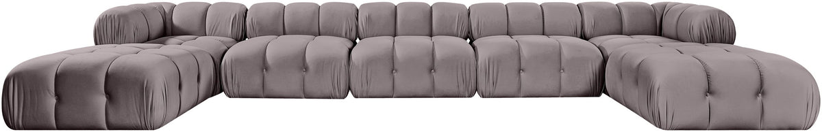 Gray modular sectional sofa with tufted cushions and rounded ottoman seat modules