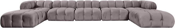 Gray modular sectional sofa with tufted cushions and rounded ottoman seat modules