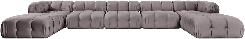 Gray modular sectional sofa with tufted cushions and rounded ottoman seat modules
