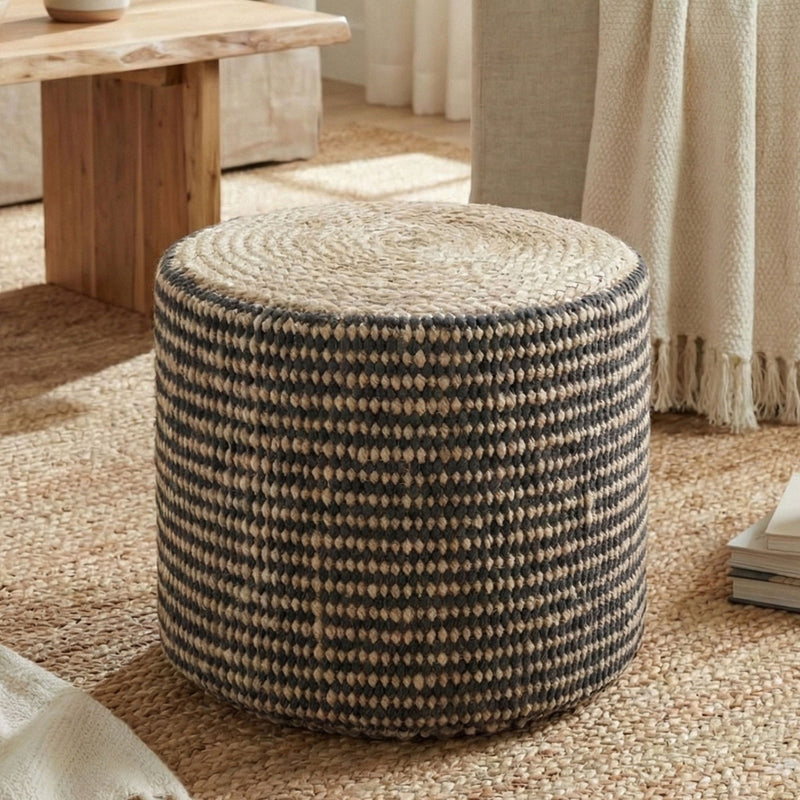 Black and cream braided round pouf ottoman with flat top, rope-knit texture